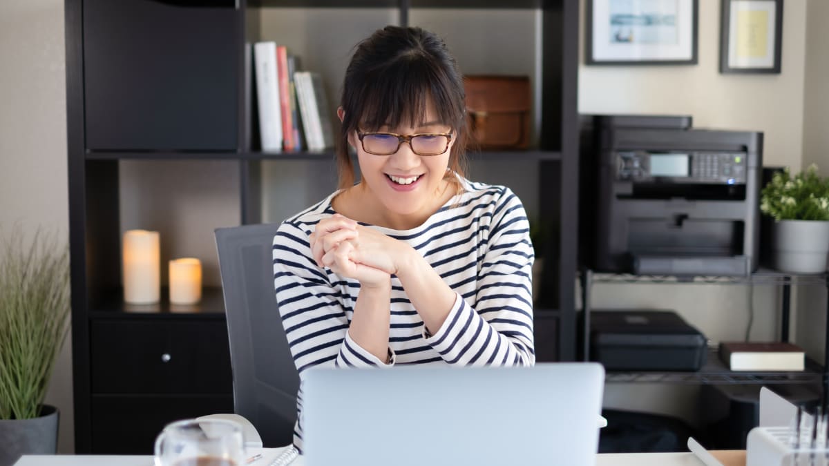 Happy woman working at a desk