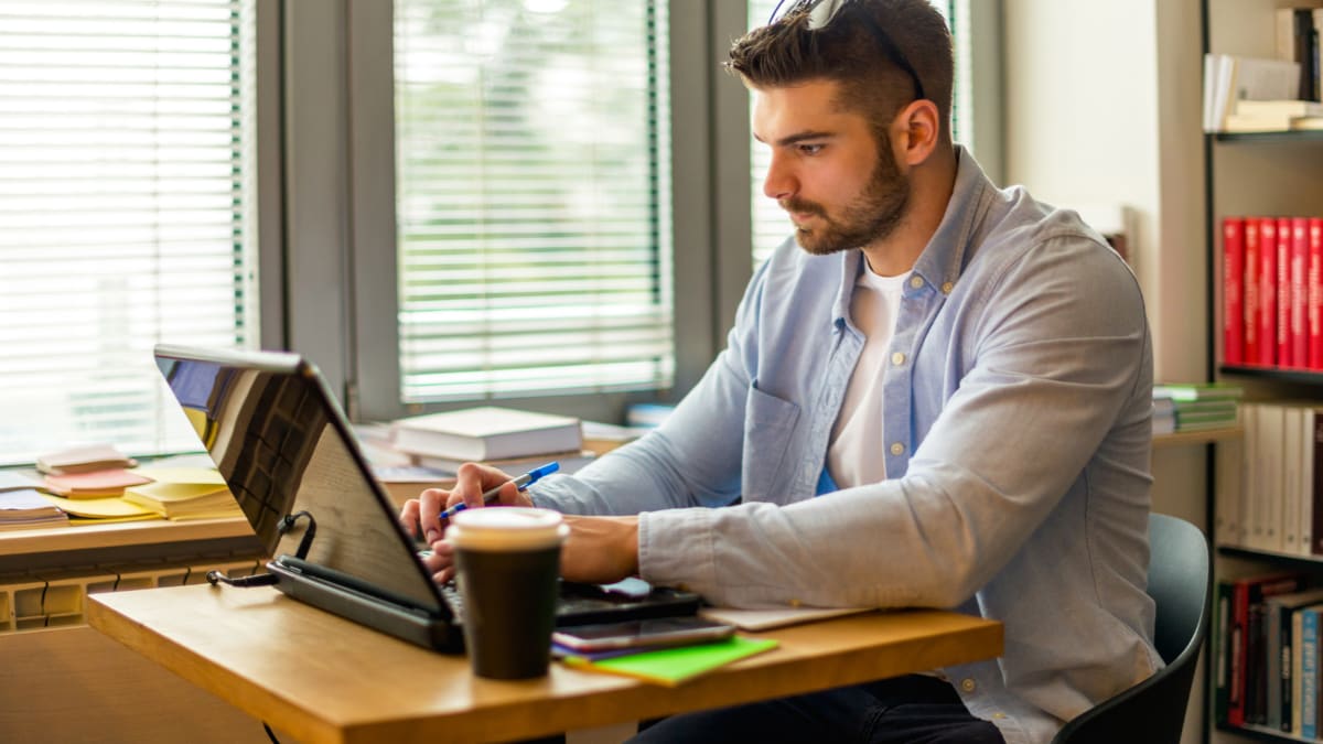 Male student studying alone
