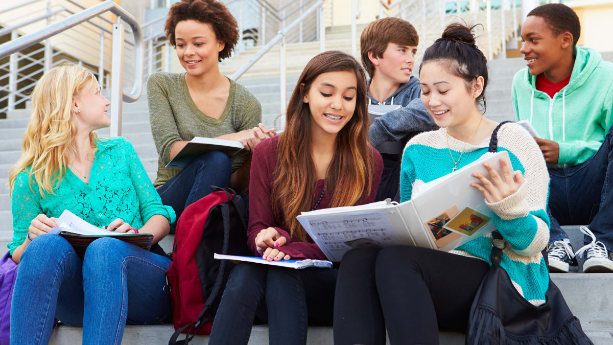 Students sitting on steps and studying