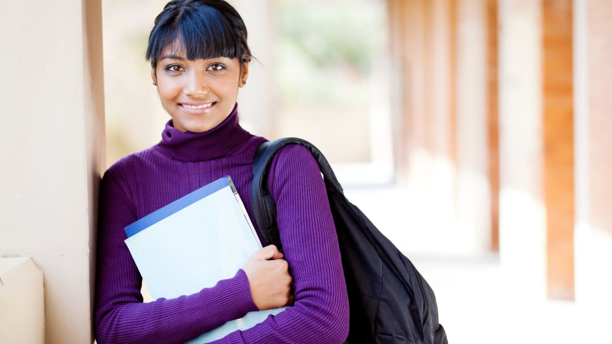 Female student holding a notebook