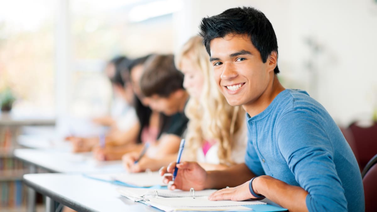 Smiling student in blue shirt