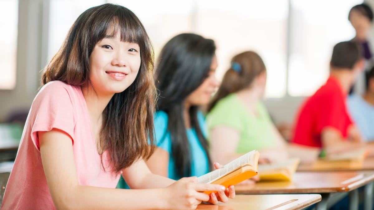 Female student smiling in a classroom