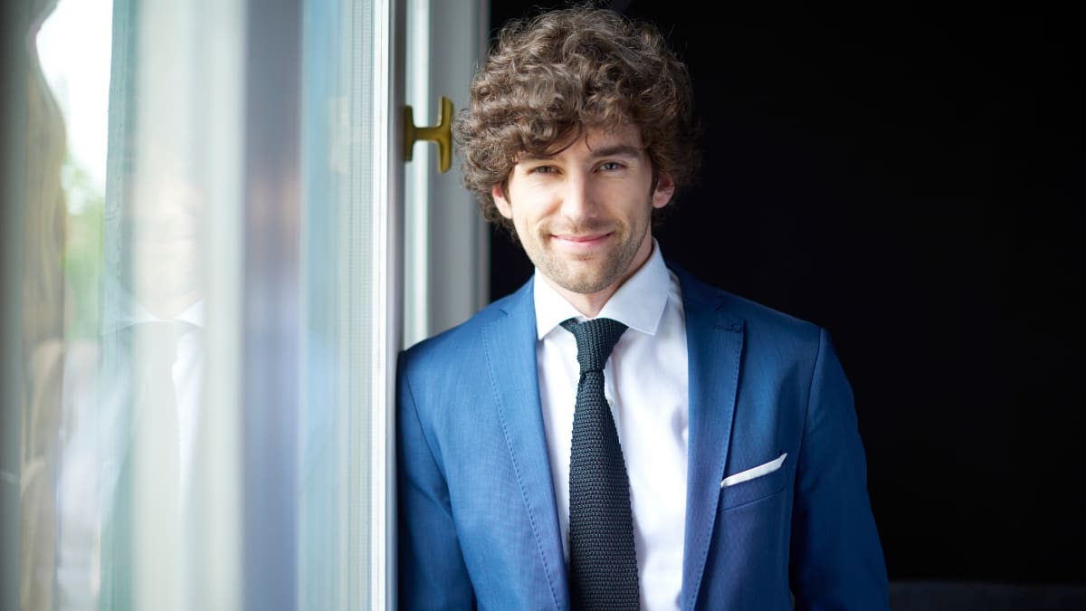 Young business professional in a blue suit