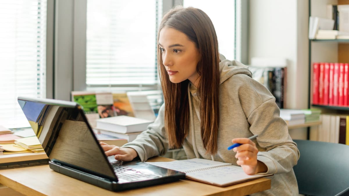 Female student studying on a laptop