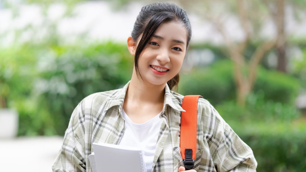 Female student smiling outside