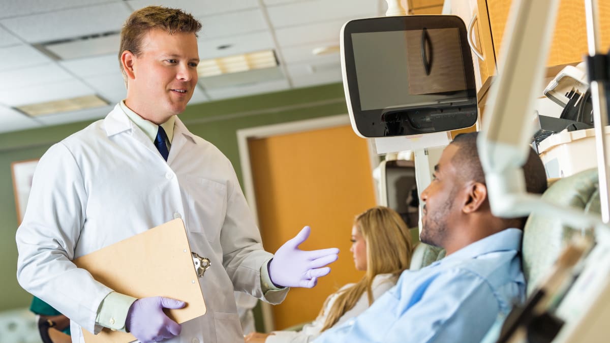 Phlebotomist talking to a patient