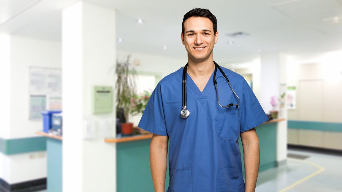 Male nurse standing in the hospital lobby