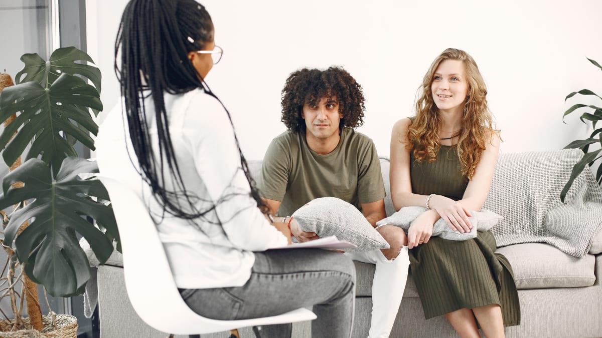 Psychologist talking to a couple