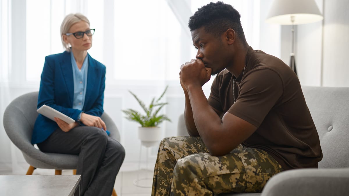 Psychologist speaking to a veteran