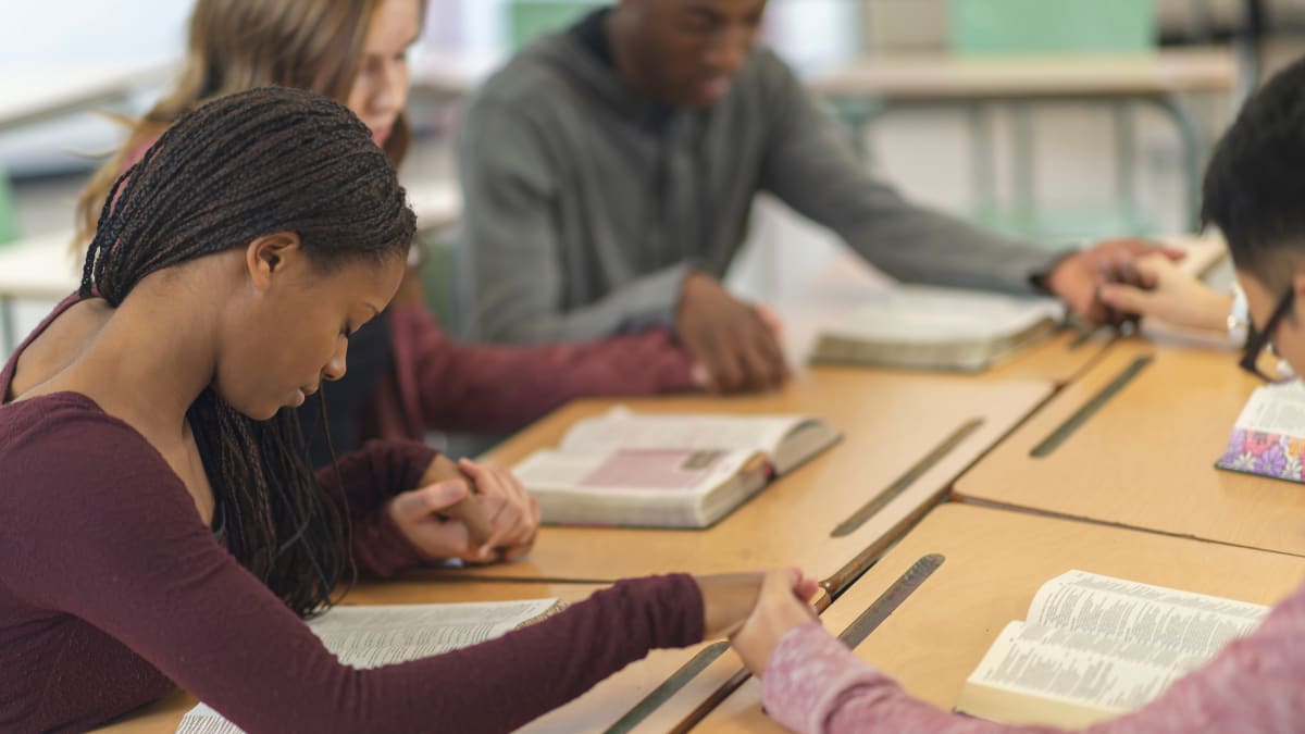 Students praying at a religious school