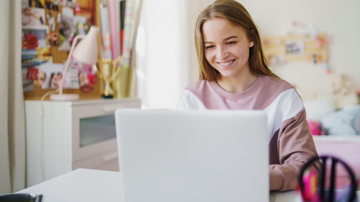 Female student working from her bedroom
