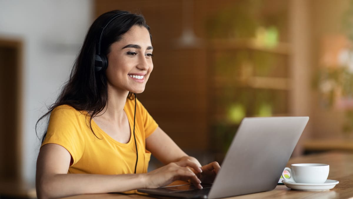 Happy woman using a laptop