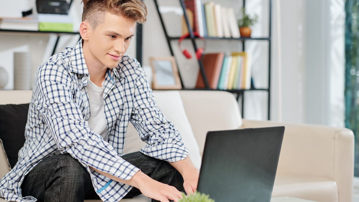 Man studying on a sofa