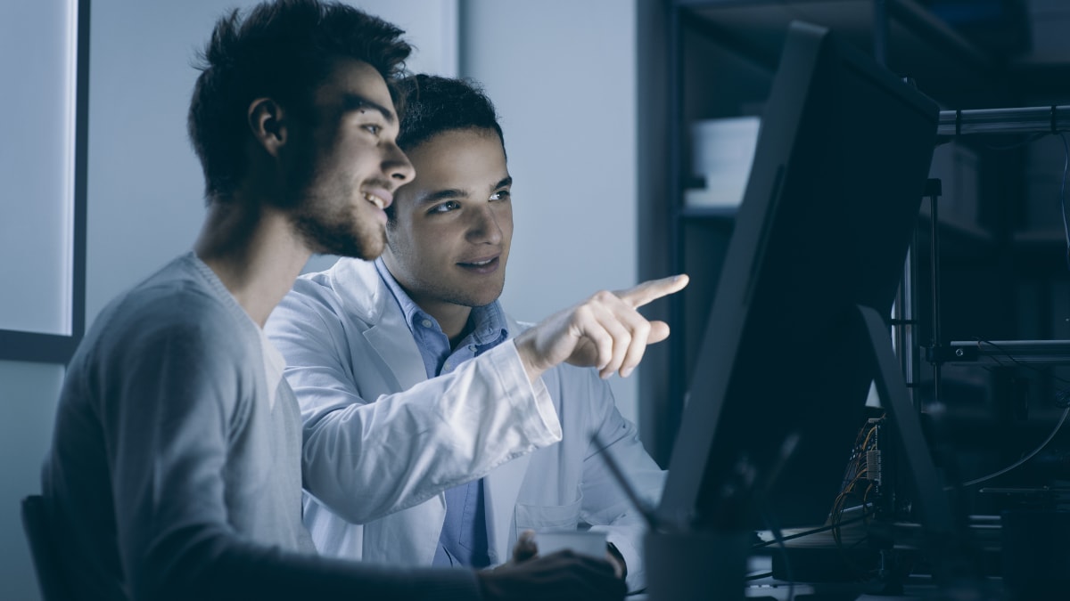 Two people working on a computer