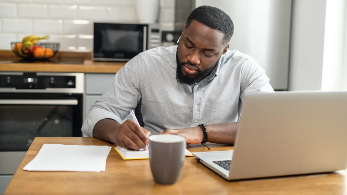 Man working at kitchen table