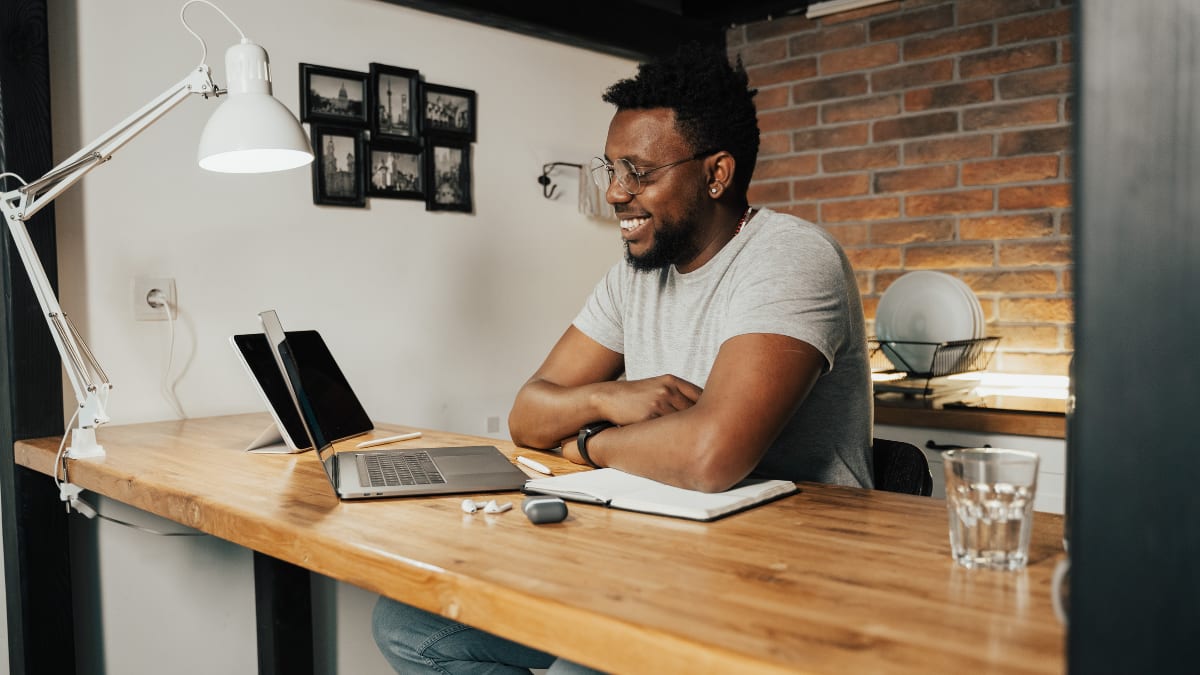 Smiling man working from home