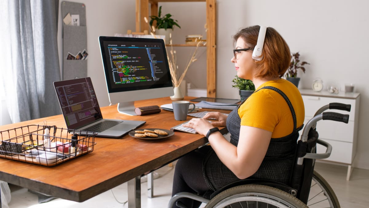 Woman in a wheelchair coding