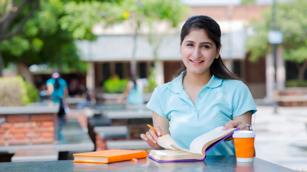 Female student studying outside