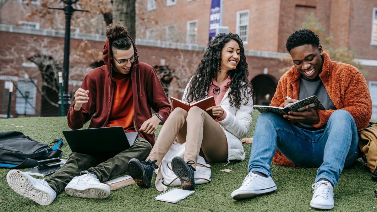 Three students studying outside