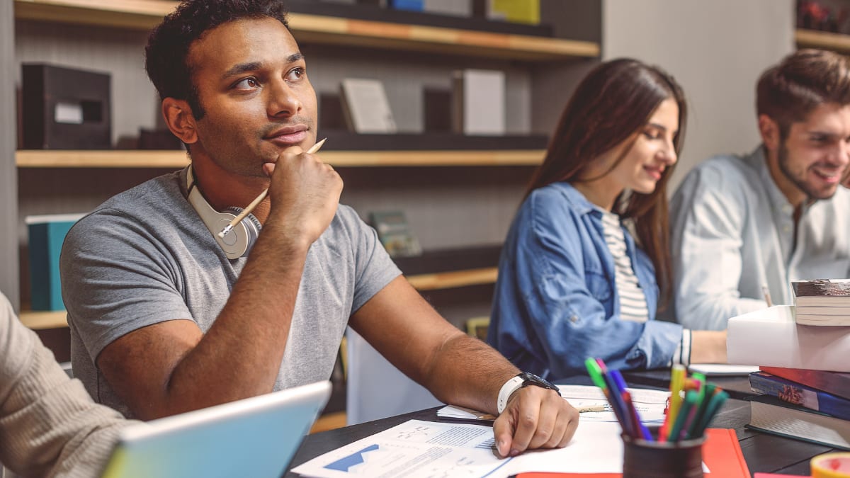 Student thinking about a class assignment