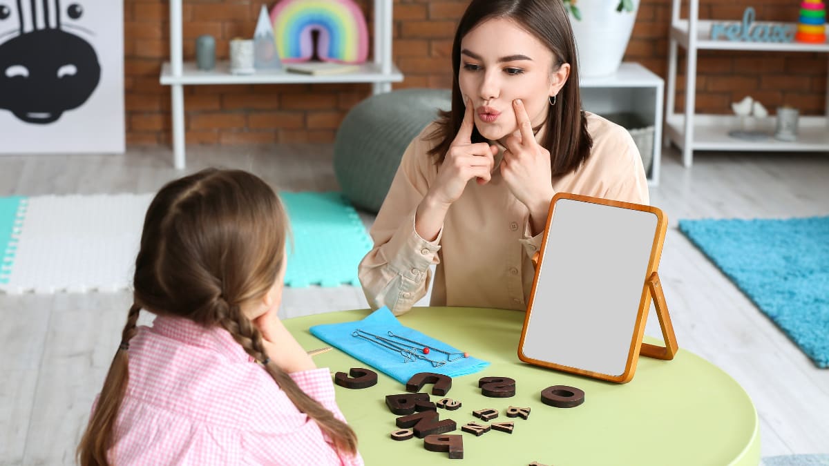 speech language pathologist teaching child