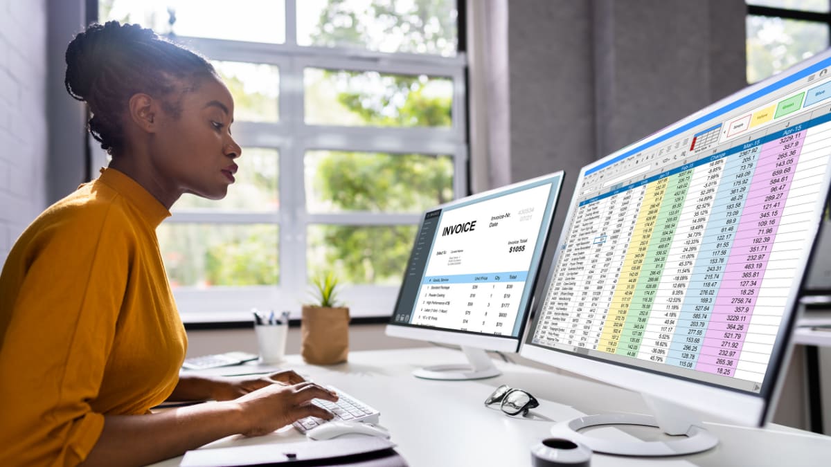 Young woman reviewing accounts for a business