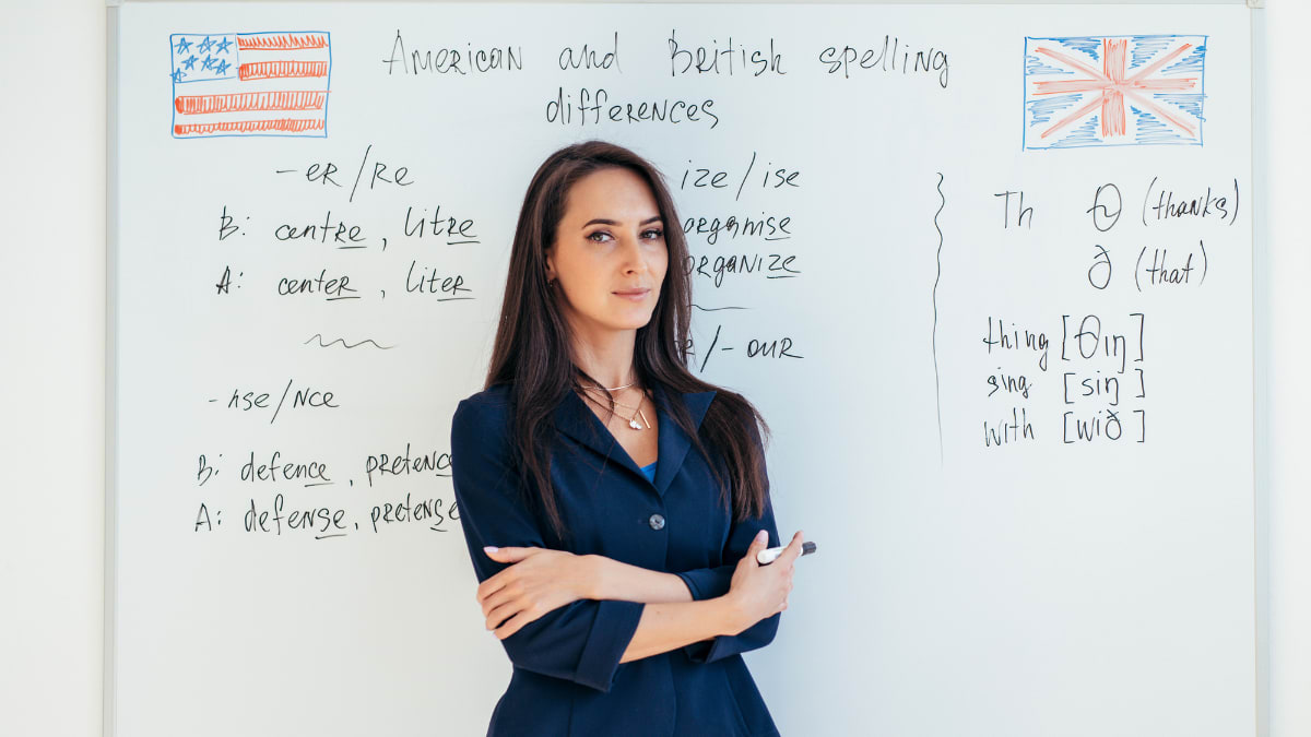 Female English teacher standing in front of a whiteboard