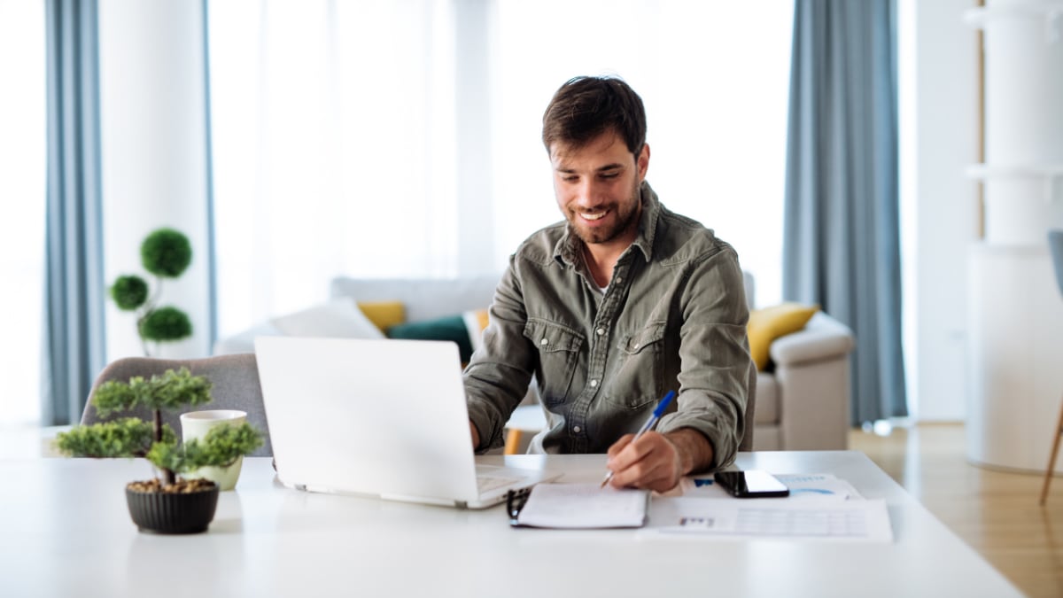 male college student working on online college coursework