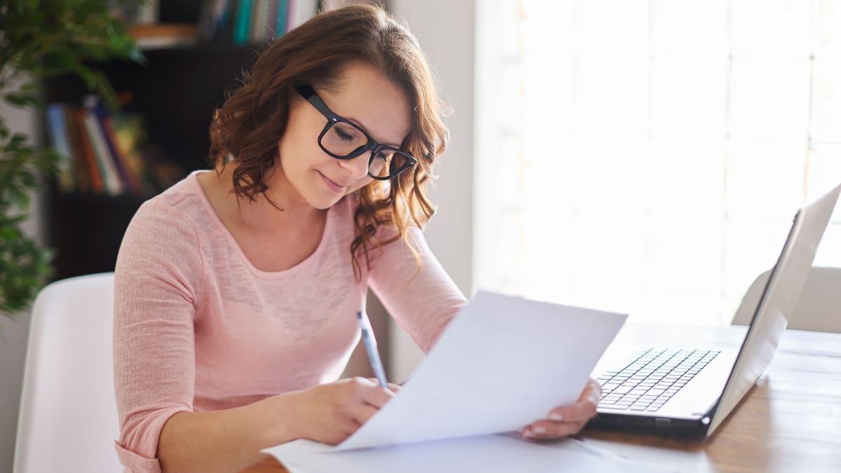 Female writer sitting in front of her laptop