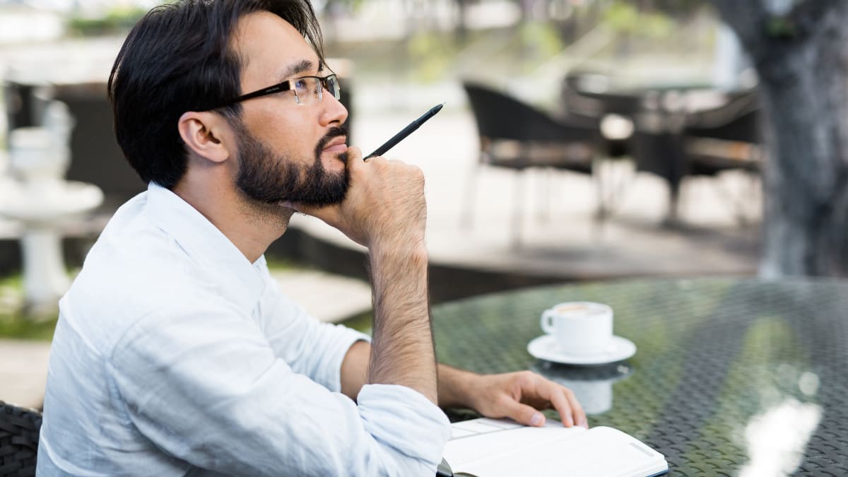 Male writer working on a manuscript