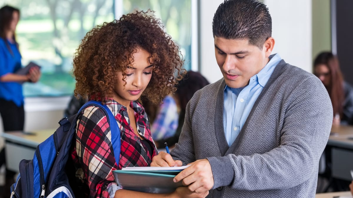 Male English teacher with student