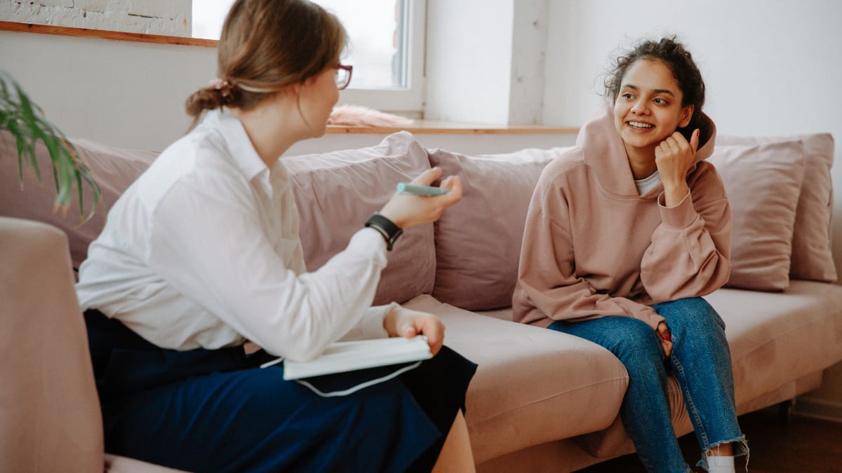 female psychologist talking with a young client