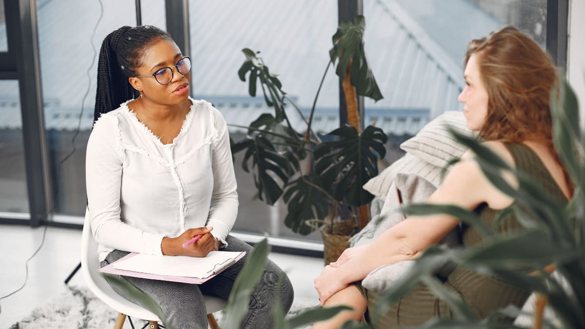 female psychologist talking with a female client