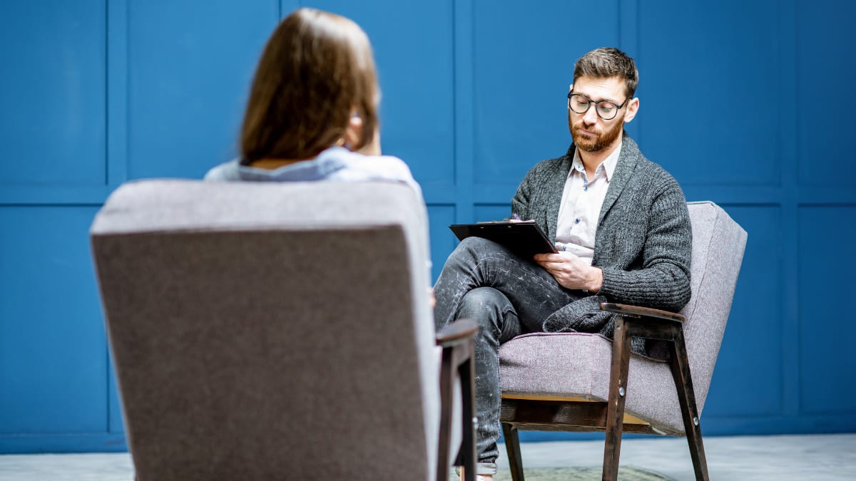 male psychologist talking with a female client