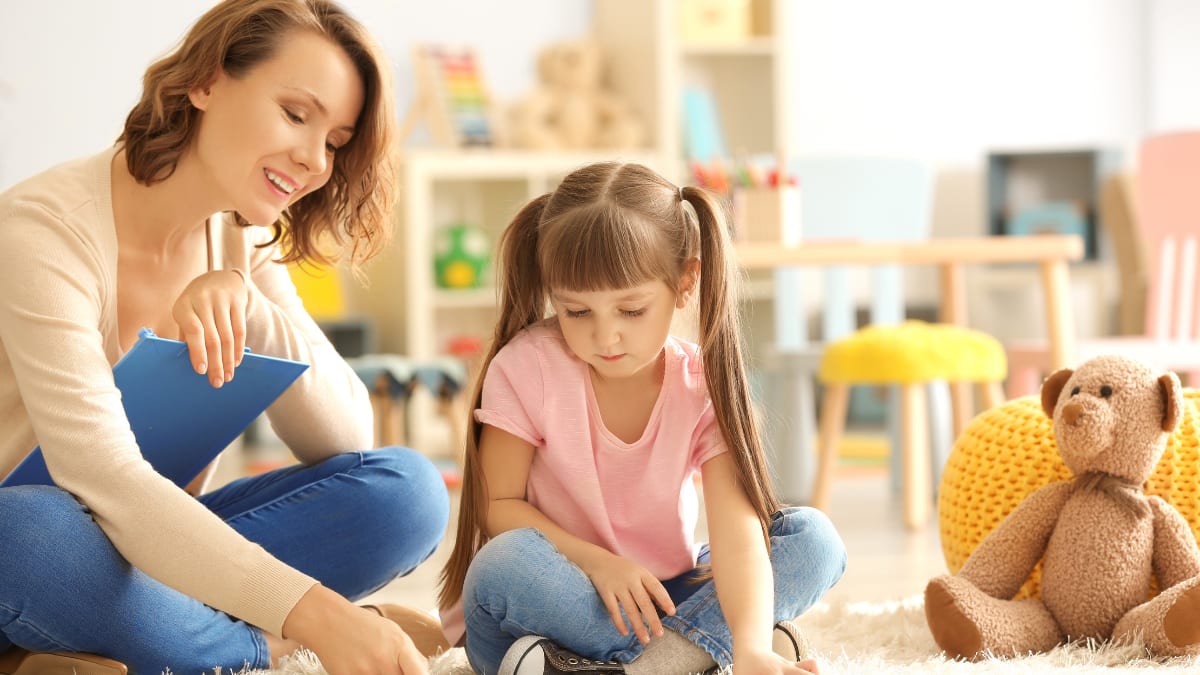Female psychologist with a young client