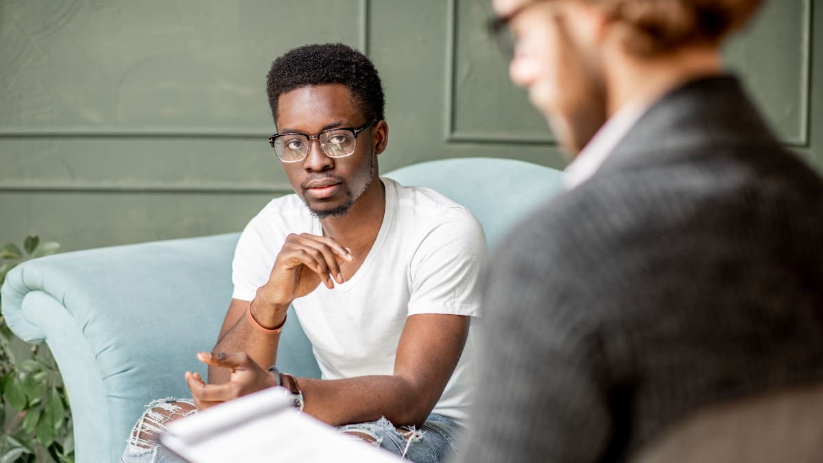 Male psychologist counseling a male client