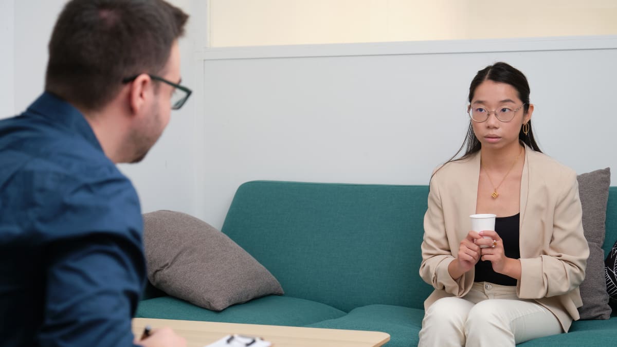 Male psychologist counseling a female client
