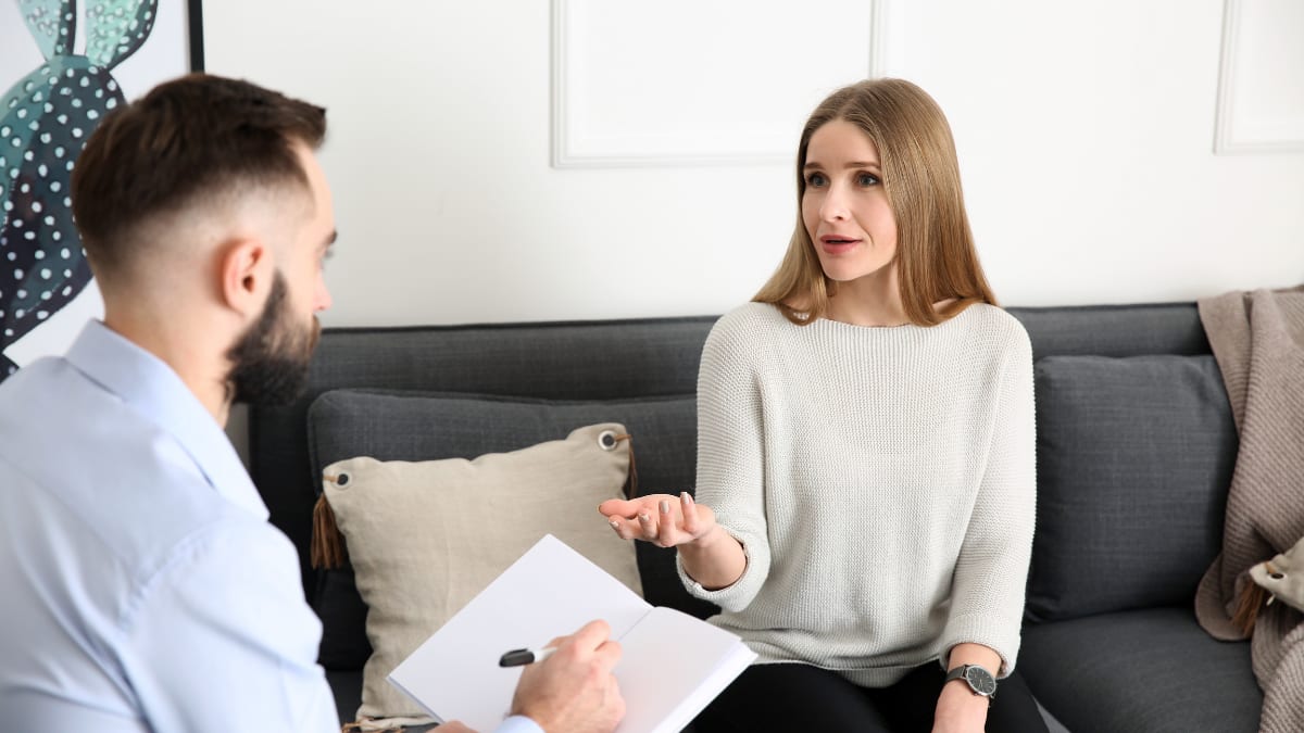 Male psychologist counseling a female client