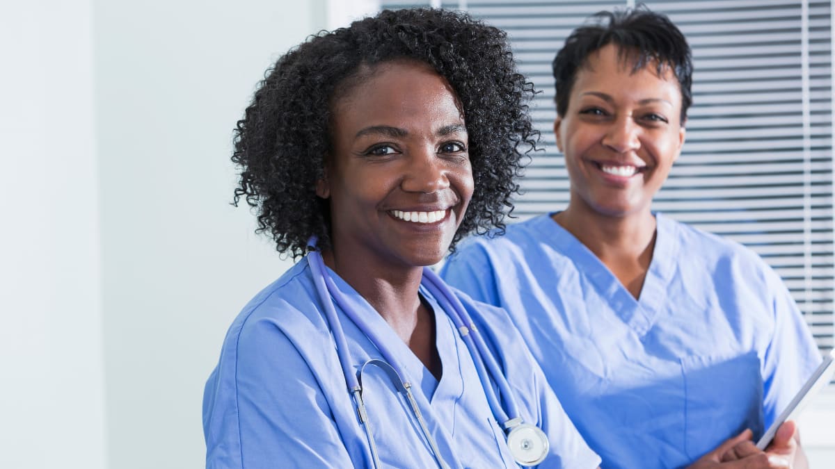 Two smiling female nurses