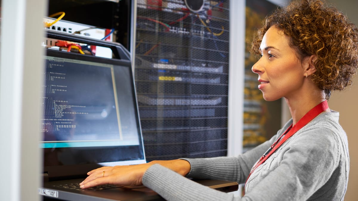 female IT technician looking at a computer monitor