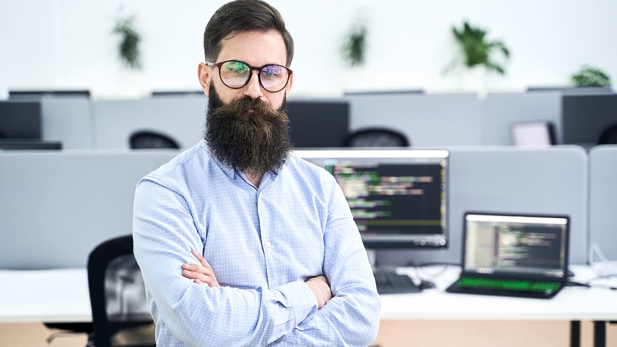 computer programmer standing in an office