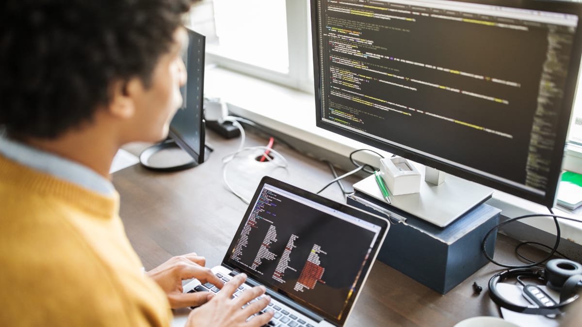 software engineering working at this desk in front of a computer monitor