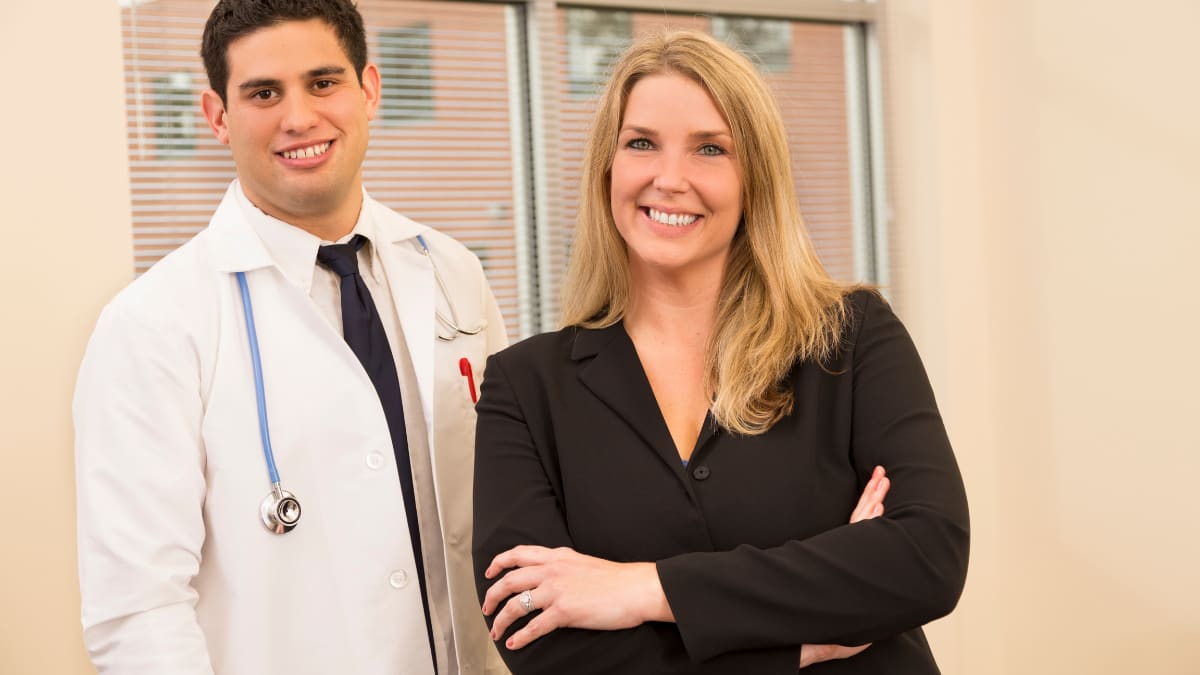 hospital administrator standing with a doctor