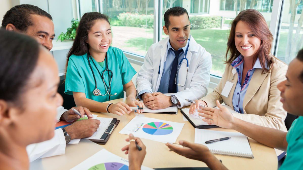 hospital administration sits in on a round table with hospital personnel