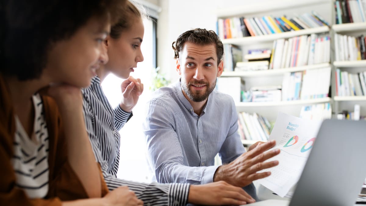 two information technology professionals working together