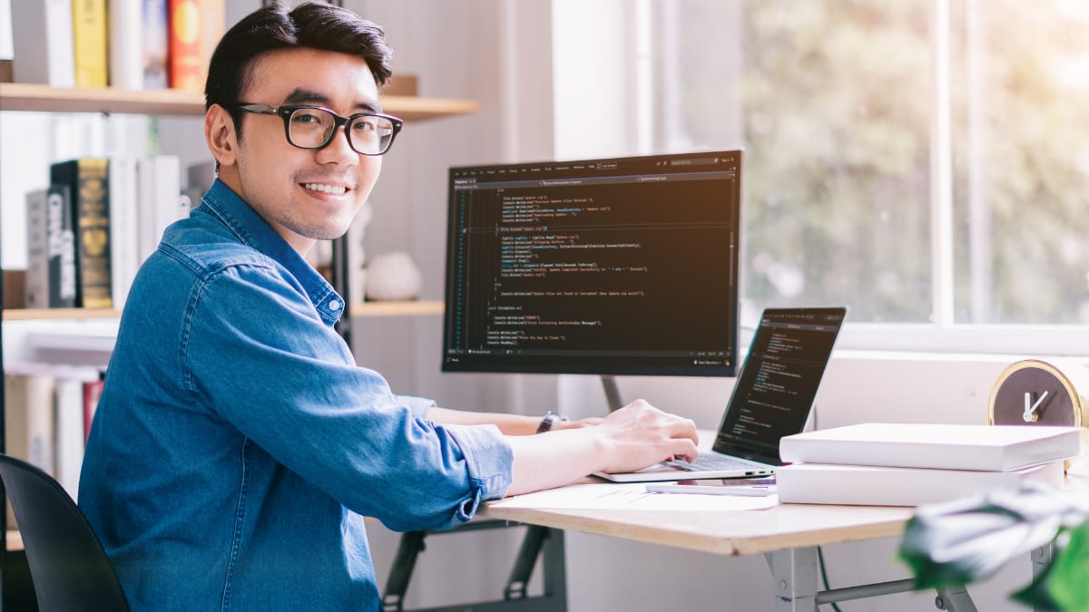 software programmer sitting at a desk