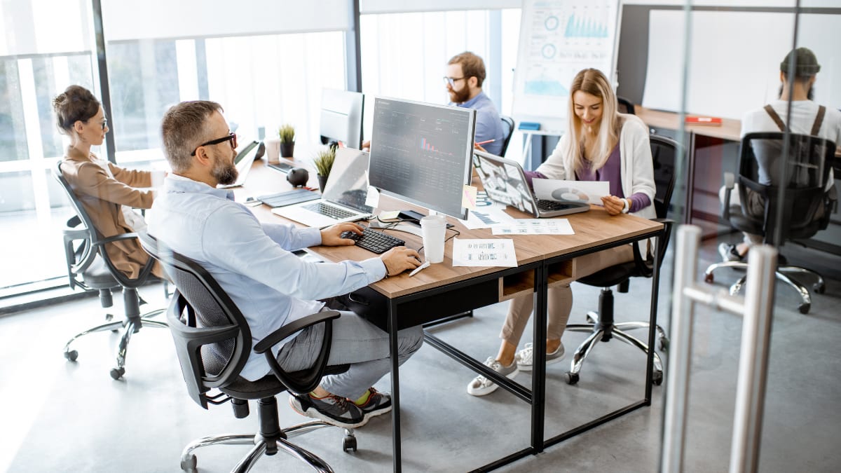team of information technology professionals working in an office