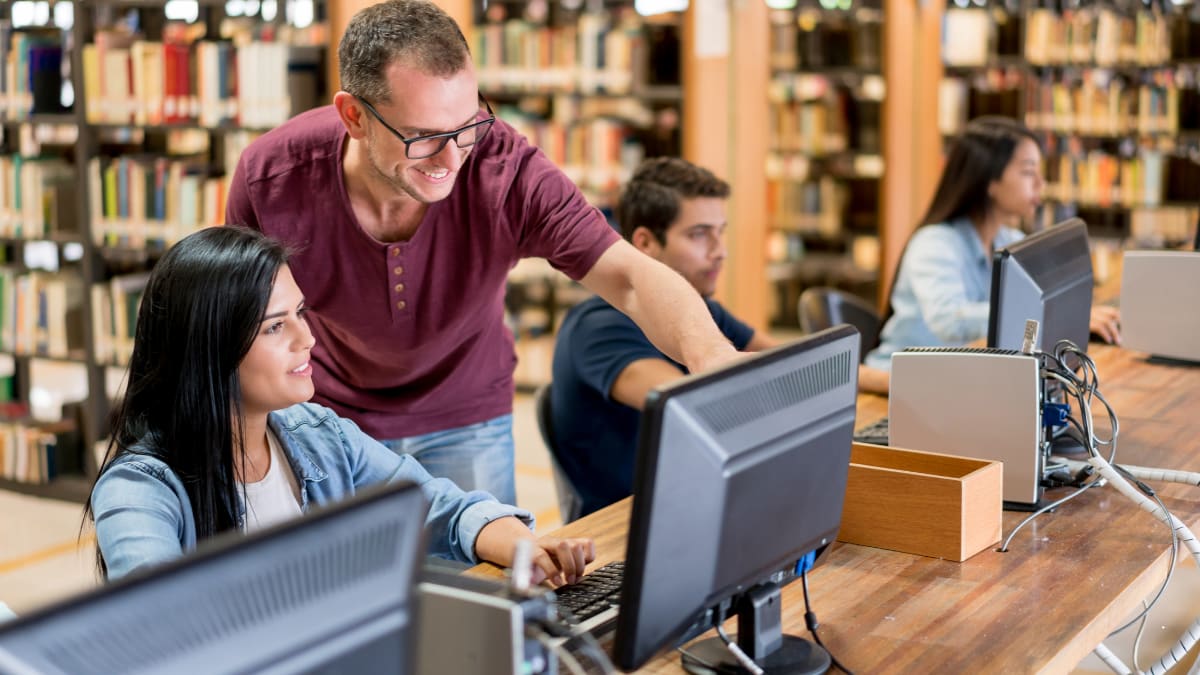 information technology doctorate student teaching a computer class