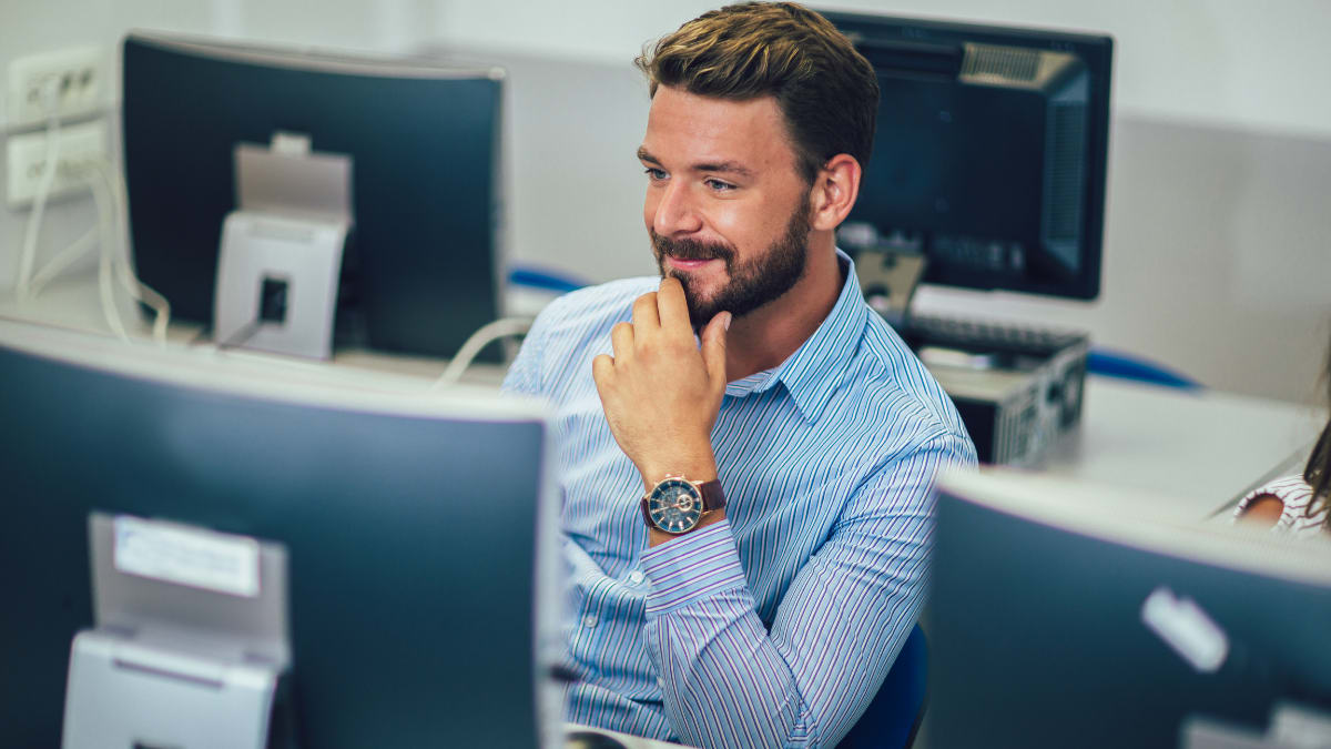 information technology doctoral candidate working in a computer lab