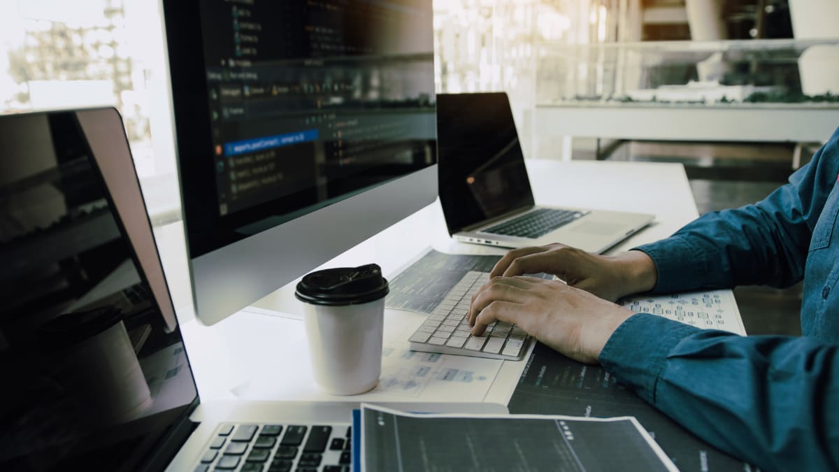cyber security analyst working at a computer
